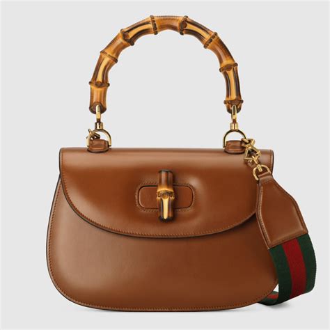 gucci bamboo handle bag first|gucci suede bamboo bag.